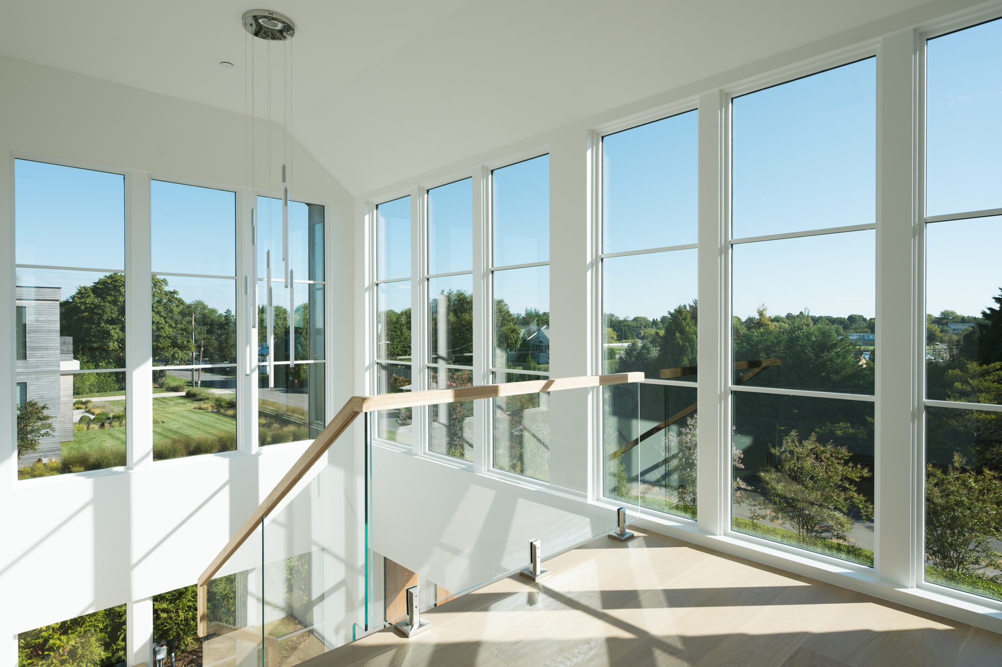 Glass-walled upper hall overlooking the marsh