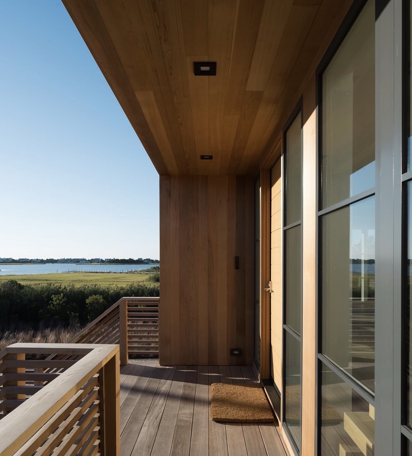 Cedar-lined balcony overlooking the marsh and bay