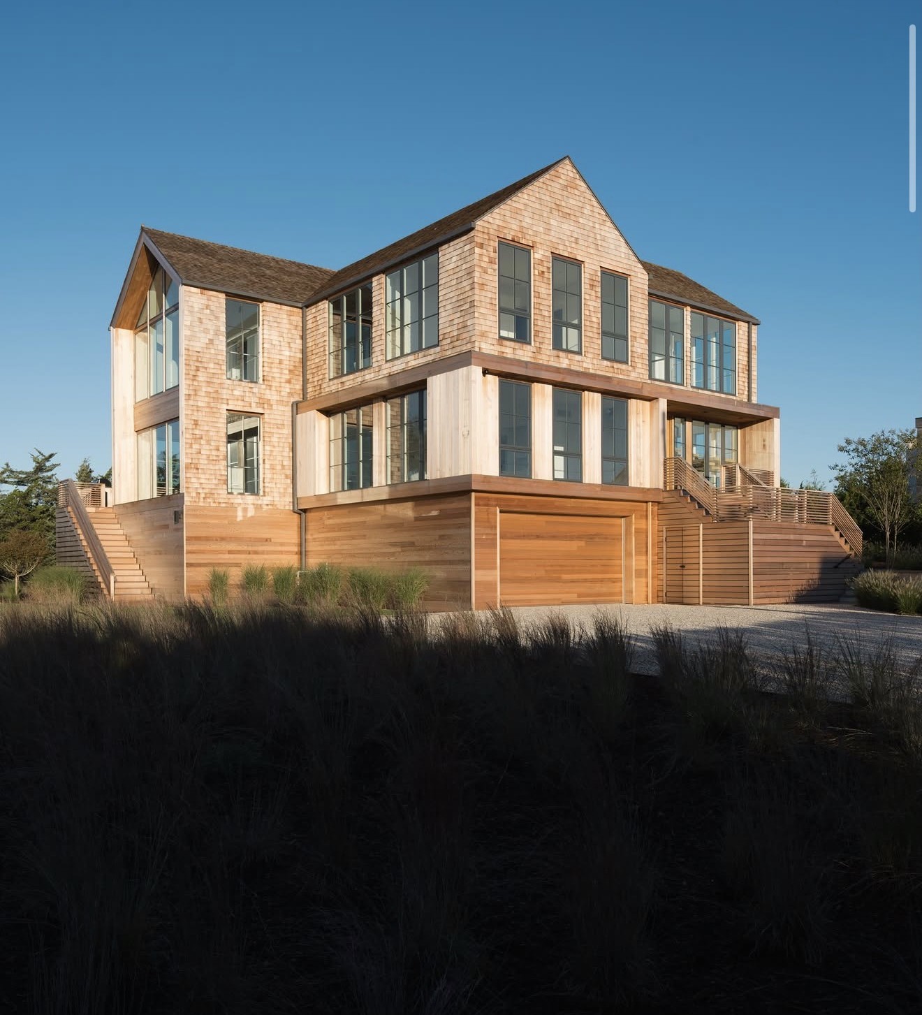 Cedar-shingled East End home at golden hour